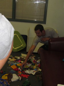 Josh Bogner of Avery Dennison reaches for the second part of a plastic toy at Forbes House on the United Way Day of Caring on June 25.