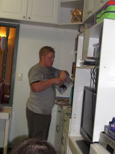 Day of Caring volunteer Ryan Lose organizes children’s books in the Forbes House playroom.