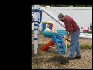 Volunteer Mike Webster moved out of the playroom and onto the playground once the rain clouds said good-bye.