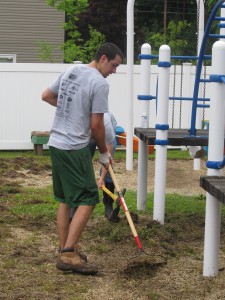 Avery Dennison employee Josh Bogner gives up sorting Legos in the playroom for raking up  weeds at Forbes House during the United Way Day of Caring on June 25th.