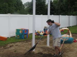 Volunteer Bryan Zelinski of Avery Dennison jumps into the fight against weeds at Forbes House  on the United Way Day of Caring on June 25th .